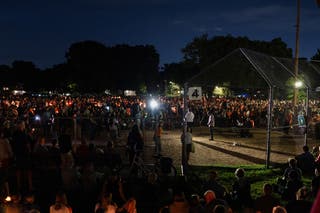People attend a vigil at Lynnhurst Park following a shooting earlier in the day at Annunciation Church in Minneapolis, Minnesota, U.S. 27 August 2025
